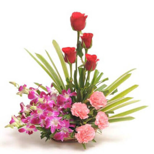cute basket of rose carnation orchid