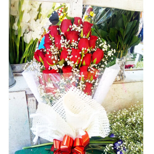 flat hand red rose bouquet
