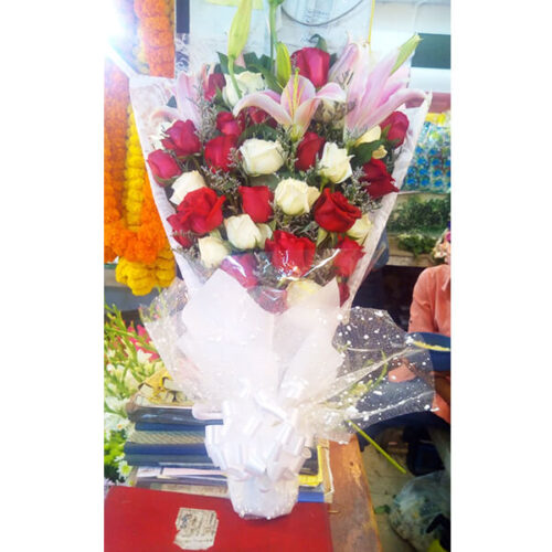 hand bouquet of colorful roses with lily limo