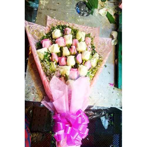 hand bouquet of white pink roses decorated with gypsy
