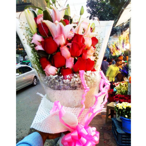 pinkish hand bouquet of colorful roses lily gypsy