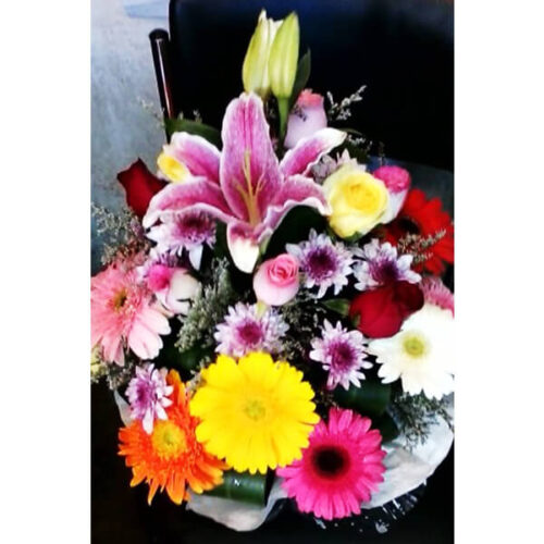 round shaped basket of mixed flowers