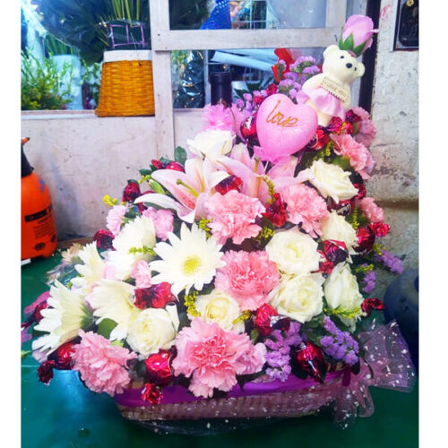 teddy love along with chocolates colorful flower basket