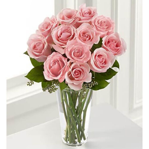 excellence of glowing pink roses in a crystal vase