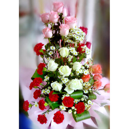 lovely spreading basket with colorful roses carnation mum