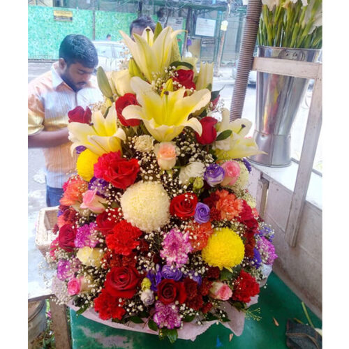 outstanding basket of mixed lily rose snowball carnation eustoma gypsy ger bera with decoration