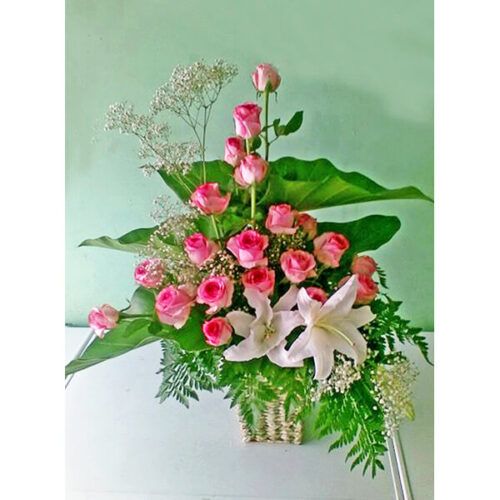 special basket of shaded pink roses with lily gypsy